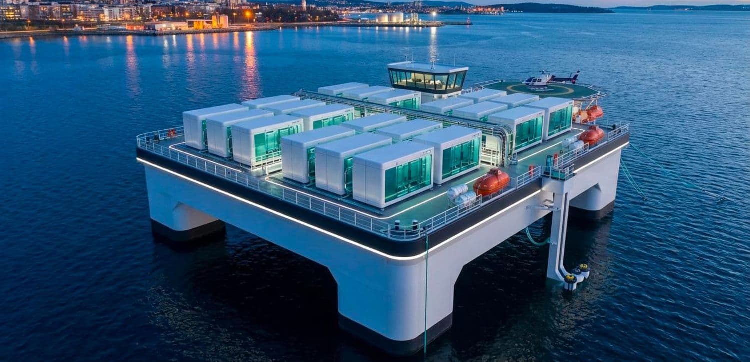 Illustrative photo of identical modular container-like units arranged on a platform, evoking a replicable, transportable installation — not a photo of an actual Revalena facility